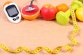 Glucose meter, stethoscope, centimeter and fresh fruits, diabetes, healthy lifestyles concept Royalty Free Stock Photo