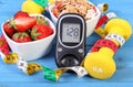 Glucometer with sugar level, healthy food, dumbbells and centimeter, diabetes, healthy and sporty lifestyle Royalty Free Stock Photo