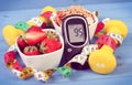 Glucometer with sugar level, healthy food, dumbbells and centimeter, diabetes, healthy and sporty lifestyle Royalty Free Stock Photo