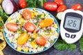 Glucometer with sugar level, salad with vegetables and bulgur groats, tape measure. Diabetes and healthy meal containing natural