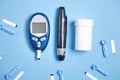 Glucometer with test strips and other objects. Devices for measuring of glucose in the blood Royalty Free Stock Photo