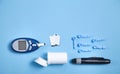 Glucometer with test strips and other objects. Devices for measuring of glucose in the blood Royalty Free Stock Photo