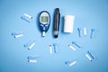 Glucometer with test strips and other objects. Devices for measuring of glucose in the blood Royalty Free Stock Photo