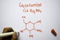 Glucosamine C16,H13,NO5 molecule written on the white board. Structural chemical formula. Education concept