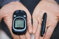 Glucose, glucometer and hands with needle for diabetes and blood sugar test, check and monitor. Healthcare, wellness and