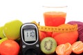 Glucose meter, fruits, tape measure, juice and dumbbells Royalty Free Stock Photo