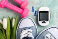 Glucose meter, gumshoes, pink dumbbells