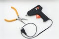 Glue gun and pliers for DIY work