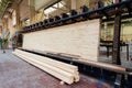 Glued pine timber beams in woodworking factory