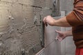 Gluing tiles on the wall. Laying tiles on the wall