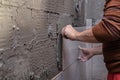 Gluing tiles on the wall. Laying tiles on the wall