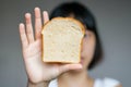 Gluten allergy, woman hand holding bread slice, refusing to eat, Gluten intolerant and Gluten free diet concept