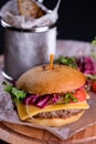 Gluten Free closeup homemade tasty burger on wooden board with organic beef, tomato, cheese and red onion. Delicious Royalty Free Stock Photo