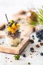 Gluten Free Granola with Coconut Yogurt, Blueberries and Mange in Jar for Healthy Breakfast