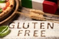 A gluten free pizza on  a rustic wood background Royalty Free Stock Photo