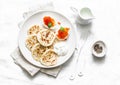 Gluten free rice flour pancakes and boiled eggs with red caviar - delicious breakfast, brunch on a light background Royalty Free Stock Photo