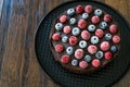 Gluten Free Vegan Chocolate Raw Cake with Raspberries and Blueberries Royalty Free Stock Photo
