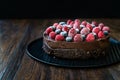 Gluten Free Vegan Chocolate Raw Cake with Raspberries and Blueberries Royalty Free Stock Photo