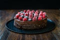 Gluten Free Vegan Chocolate Raw Cake with Raspberries and Blueberries Royalty Free Stock Photo