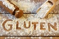Gluten word with wood background Royalty Free Stock Photo