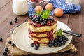 Glutten-free pancakes with jam and blueberries