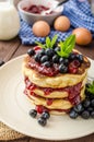 Glutten-free pancakes with jam and blueberries