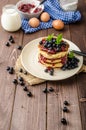 Glutten-free pancakes with jam and blueberries