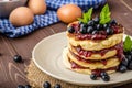 Glutten-free pancakes with jam and blueberries