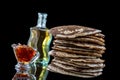 Glutten-free pancakes with jam and Maple syrup, bio healthy ingredients, on black