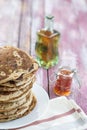 Glutten-free pancakes with jam and Maple syrup, bio healthy ingredients, on kitchen background