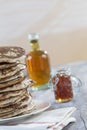 Glutten-free pancakes with jam and Maple syrup, bio healthy ingredients, on white