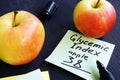 Glycemic index of apple on a piece of paper. Royalty Free Stock Photo