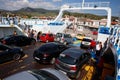 Glyfa village, Greece - August 15, 2023: Vehicles and people travelling from Evia island exiting ferryboat at the harbour of Glyfa