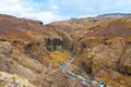 Glymur waterfall in Iceland gorge behind fall cutting through colorful autumn landscape Royalty Free Stock Photo