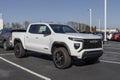 GMC Canyon Elevation pickup display at a dealership. GMC offers the Canyon in Elevation, AT4, Denali, and AT4X models