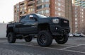 GMC Denali truck parked on a street. Black truck at the city