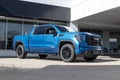 GMC Sierra 1500 pickup display at a dealership. GMC offers the Sierra in HD, HD Pro, AT4 and Denali models