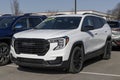 GMC Terrain SUV display at a dealership. GMC offers the Terrain in SLE, SLT, AT4 and Denali models