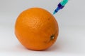 GMO. Experiment on the orange. Bioengineering food, genetically modified product.