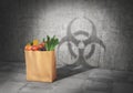 GMO concept. Danger food. Pack full of products cast shadow in form of biohazard sign. 3d Royalty Free Stock Photo