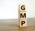 GMP symbol. Concept words `GMP, good manufacturing practice` on cubes on a beautiful white background. Business and GMP, good Royalty Free Stock Photo