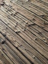 Gnarled, worn wood on a boat boardwalk by Lake Washington on a sunny day