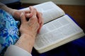 Gnarly Saintly Hands on Bible Royalty Free Stock Photo