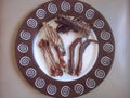 Gnawed chicken bones on a platter. Abstract.