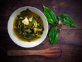 Gnetum gnemon or melinjo leaves and fish in yellow hot and sour soup Royalty Free Stock Photo