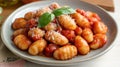 Gnocchi al Pomodoro: A Culinary Delight with Tomato Sauce and Fresh Basil Royalty Free Stock Photo
