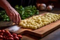 gnocchi being shaped on a ridged board Royalty Free Stock Photo