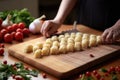 gnocchi being shaped on a ridged board Royalty Free Stock Photo