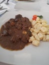Gnocchi and Boar Stew Served on White Plate