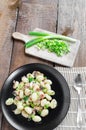 Gnocchi pasta with ham, spring onion